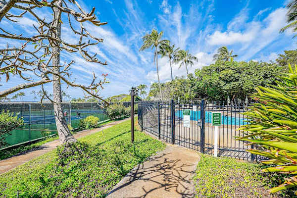 Garden paths leading to resort amenities and ocean views