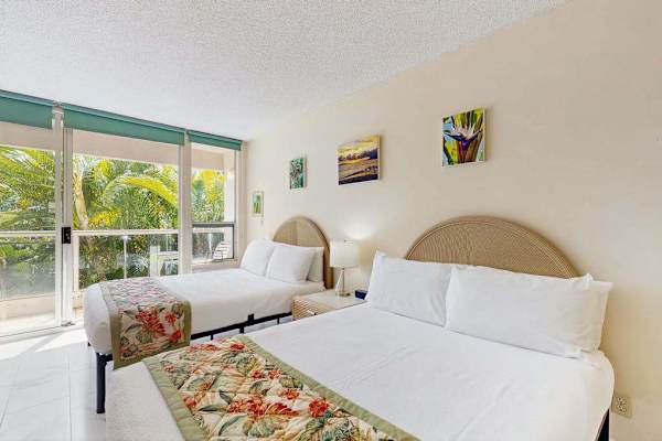 Cozy bedroom with peaceful garden views and two double beds