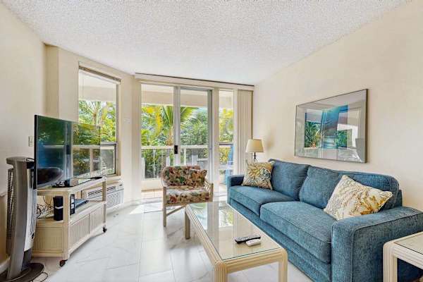 Bright living area with comfortable seating and a sleeper sofa
