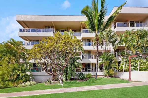 Inviting property exterior with island landscaping