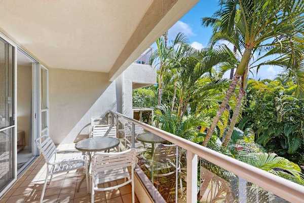 Covered lanai overlooking lush tropical surroundings