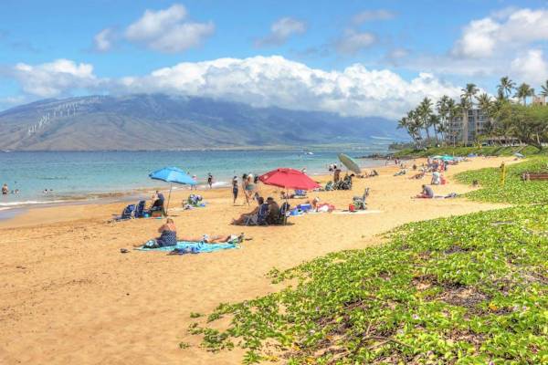 Beautiful sandy beach with stunning ocean and mountain views