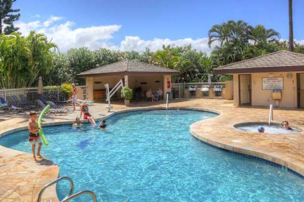 Relaxing pool area surrounded by tropical greenery