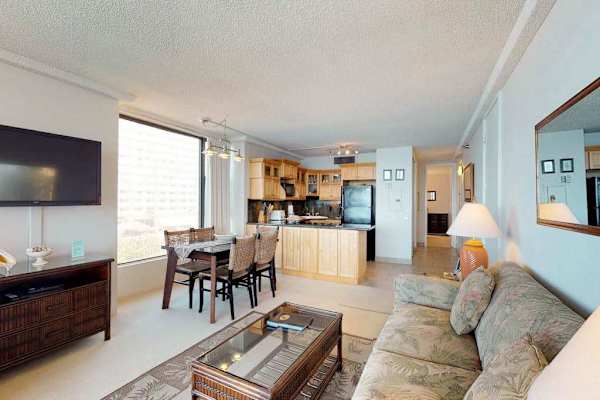 Living room with a sofa bed for extra company and a flat screen tv.