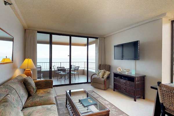 Living room with a sofa bed for extra company and a flat screen tv.