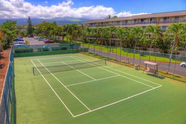 Spacious tennis courts surrounded by beautiful island scenery