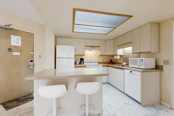 Bright kitchen with convenient breakfast bar seating
