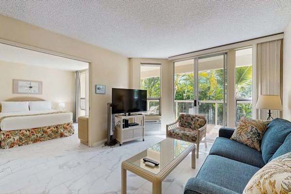 Bright living area with comfortable seating and garden views
