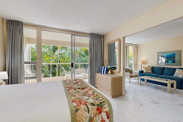 Peaceful bedroom with tropical views and natural light