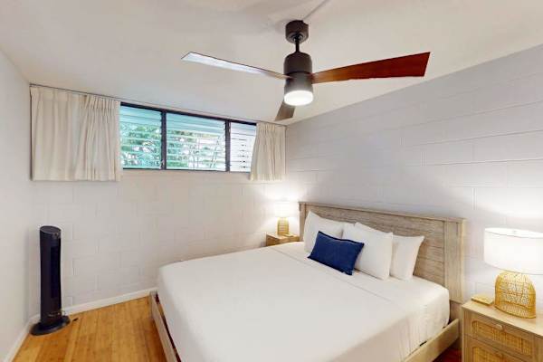 Peaceful Guest Bedroom with Plush Queen Bed & Ceiling Fan