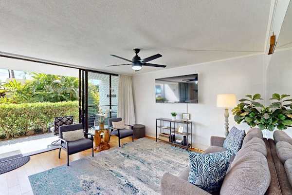 Sunlit Living Room Opening to Private Patio