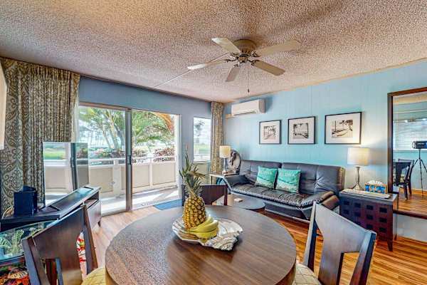 Lovely home decor, spacious living room with a flat screen tv and sleeper sofa.