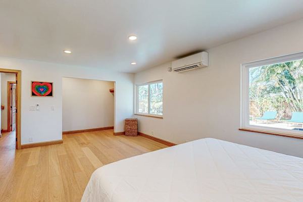 Reveals airy windows hardwood floors and comfortable sleeping space