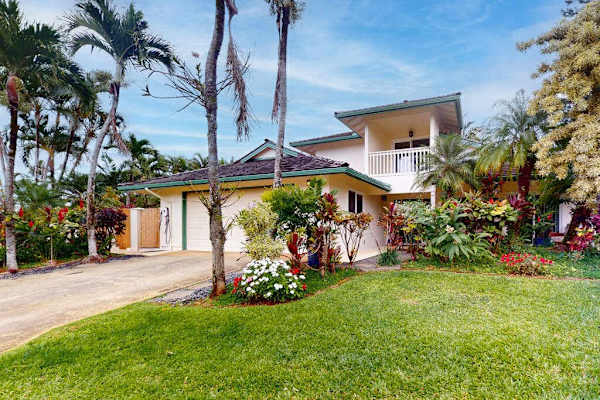 Kohola Hale welcomes guests among palms gardens and island charm
