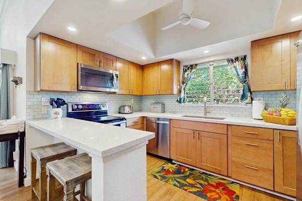 Functional kitchen includes spacious appliances and convenient meal preparation space.