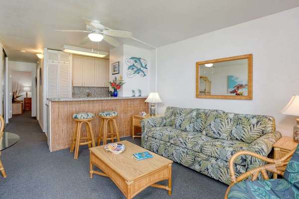 Open concept living room with sofa bed for guests.