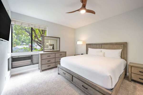 Comfortable bedroom with a TV and relaxing garden views