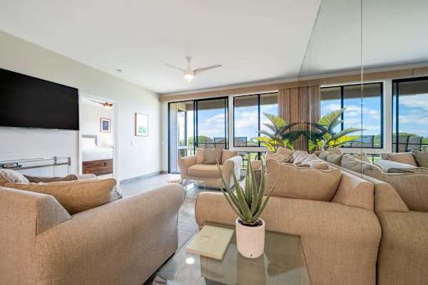 Open living area with plenty of natural light and comfortable seating