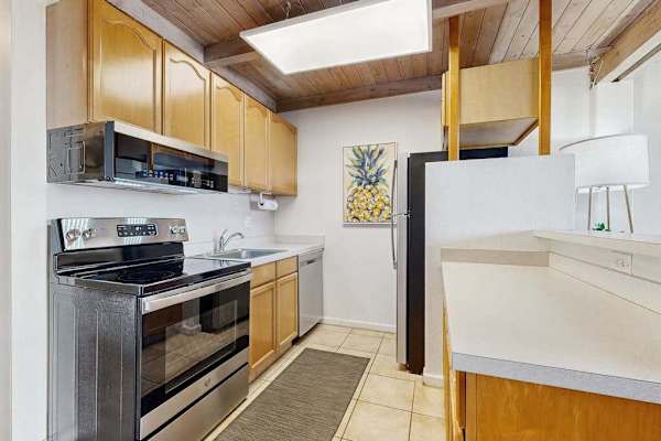 Fully stoked kitchen with stainless steel appliances.