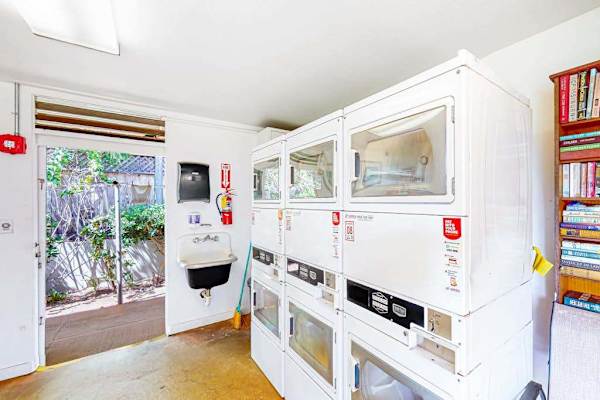 Bright Shared Laundry Space With Garden Access
