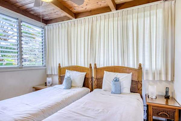 Relaxing guest bedroom with two twin beds