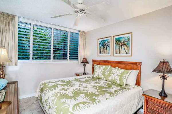 King sized bed with ceiling fan for even comfort.
