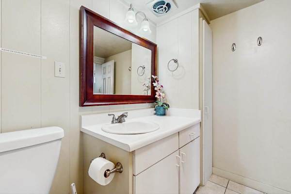 Primary bathroom with tiled walk in shower.