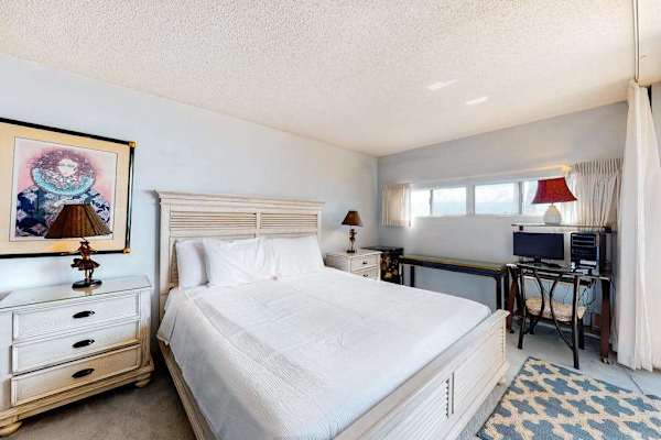 Guest bedroom with queen sized bed.