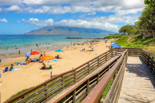 Scenic beach access with golden sand and turquoise water