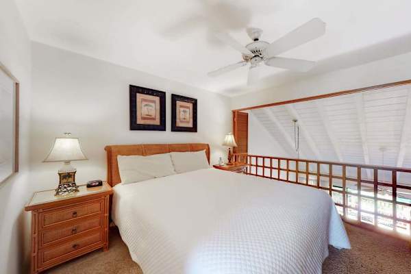 Primary loft bedroom with plantation shutters