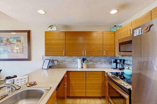 Modern Kitchen with Wooden Cabinetry, Stainless Steel Appliances, and Tile Backsplash