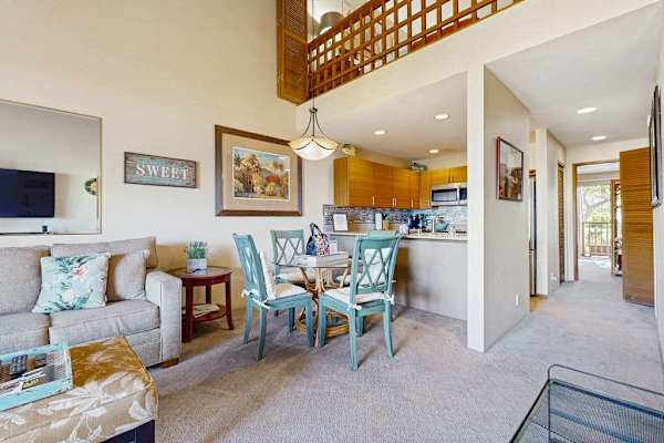 Open Living Room, Dining Table, and Kitchen View under Loft Ceiling
