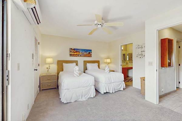 Welcomes island breezes with twin bedding and windows