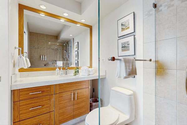 Clean full bathroom with a walk-in shower