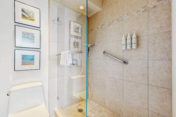 Clean Bathroom with a Spacious Shower.