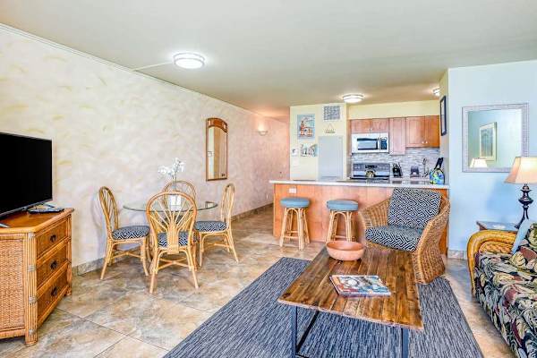 Cozy open-concept living space with a dining area and a full kitchen