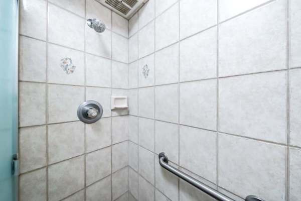 Clean And Spacious Shower Area Stocked For Guests