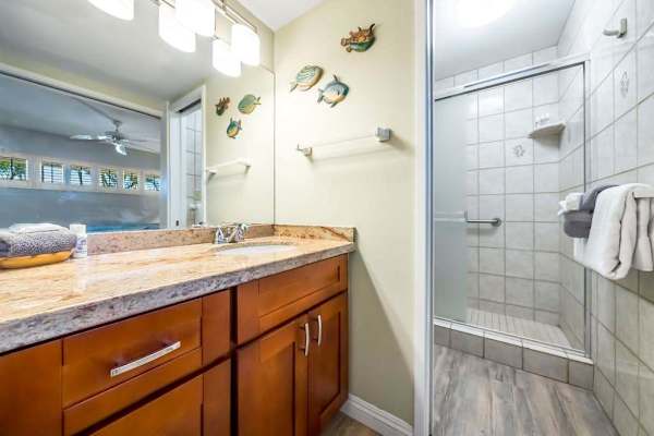 Bright En-Suite Bathroom Featuring Custom Tile Shower