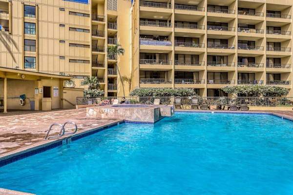Sparkling Resort Pool Surrounded By Sunshine
