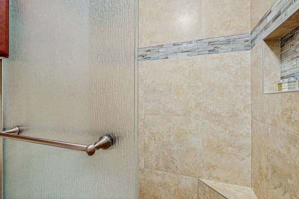 Updated primary bathroom with large walk-in shower