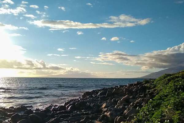 Sunset Glow Along The Rocky Shore