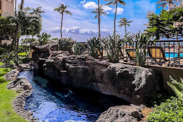 Scenic waterfall nestled within the resort gardens