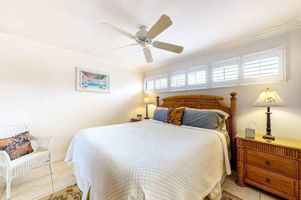Master bedroom with king bed and an en-suite bathroom.
