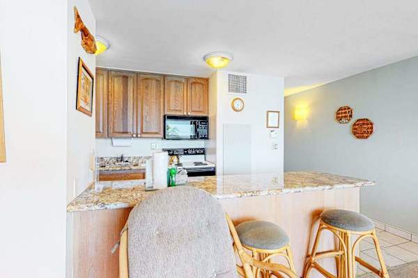 Kitchen counter with barstools for extra seating.