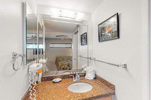 Bright, updated bathroom featuring a spacious tiled walk-in shower and modern finishes.