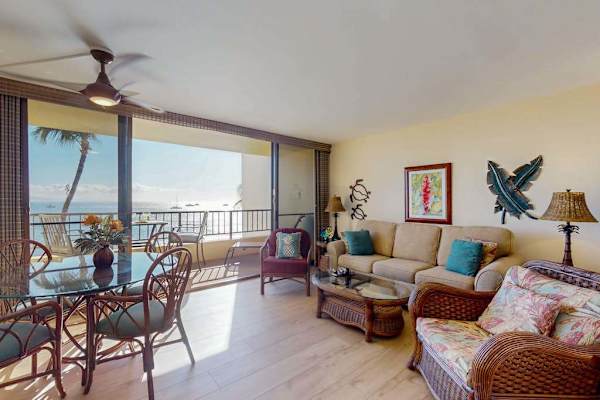 Bright living room with direct access to the private lanai and comfortable sleeper sofa