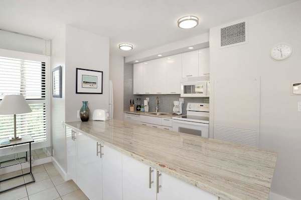 Modern new kitchen with lots of natural light and views in from the outside lanai.
