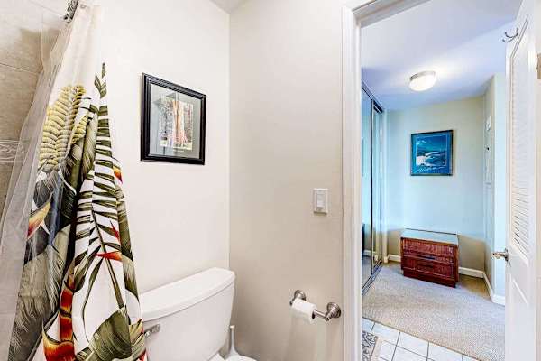 Bathroom Toilet Area & View into Primary Bedroom