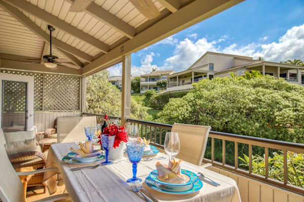 Covered Upper Patio Dining Setup Overlooking Lush Tropical Grounds
