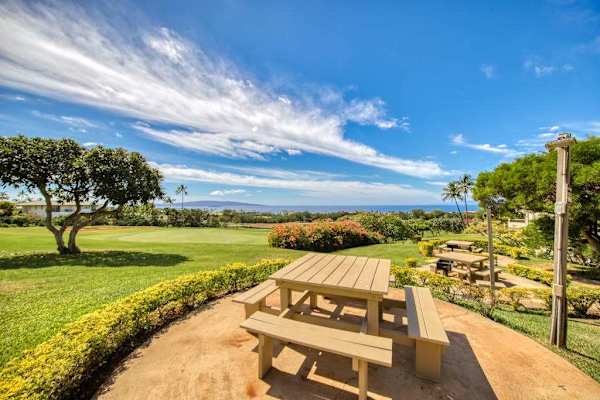 Picnic Bench Area Set Against Rolling Lawns and Ocean Horizons
